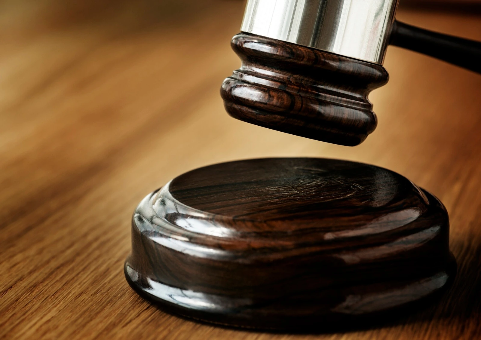 A gavel about to strike its sound block